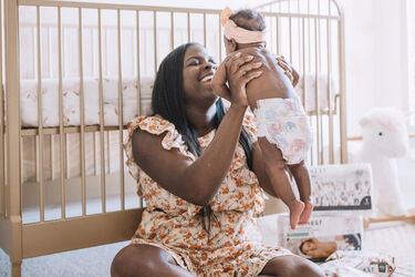 mom with baby wearing honest diapers