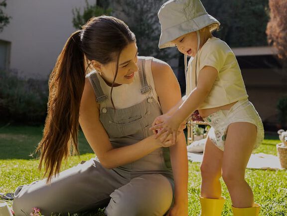 baby and mom playing