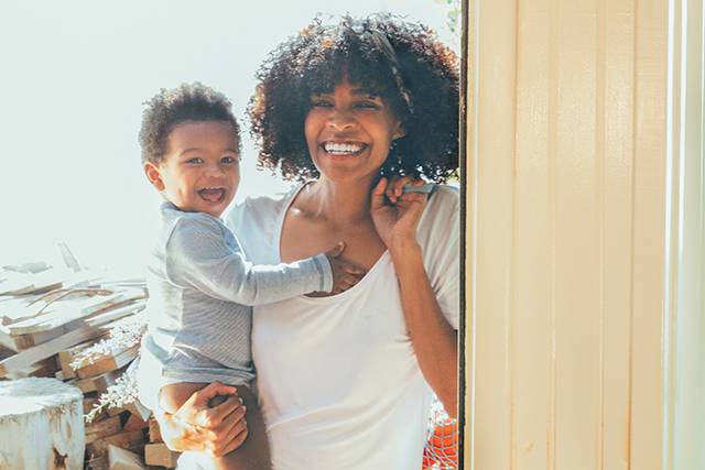 Mother and child with big smiles